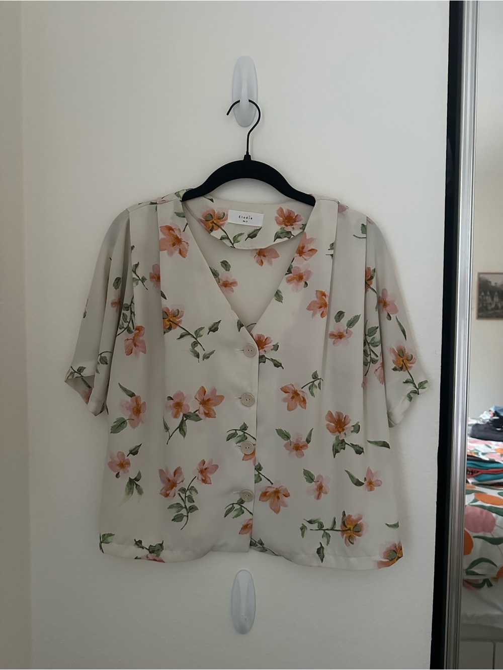 Elodie Ivory Floral Button-Front V-Neck Blouse in Cream with Peach Flowers